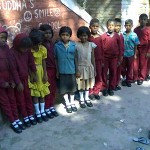 Thanks you! Prof Jay Garfield and Dr Leila Toiviainen - BSS kids wearing new shoes and socks